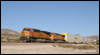 ES44C4 6604 leads auto carriers down Cajon Pass at MP58, 2010