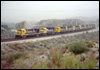 B23-7 6385 leads a mix of eight GP30s and GP35s upgrade through light snowfall near MP57, Cajon Pass, CA, 1993