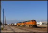 ES44DC 7703 leads an M BARSDG with Santa Fe S2 2381 tucked in six cars back on a flat car. The Alco switcher is bound for the Pacific Southwest Railway Museum in Campo, CA • Rana, CA, 2007