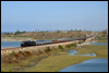 Santa Fe 3751 pulls the American Association of Private Railroad Car Owners (AAPRCO) special across Batiquitos Lagoon, in Carlsbad, CA, on its southbound run to Old Town, San Diego · 2008