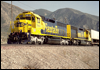 ATSF 5810 trails a pair of 5800-class SD45-2 helpers assisting a westbound intermodal down the North Track at Cajon, CA, 1991