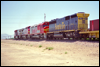 SD45-2B 5517 trails a couple of Dash 8s and an FP45 at Hesperia, CA, 1993