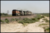 Doublestack passing West Daggett, CA, with BNSF 1090 leading KCS SD60 728, an ex-BN SD40-2 and ex-Santa Fe Dash 9-44CW, 2005